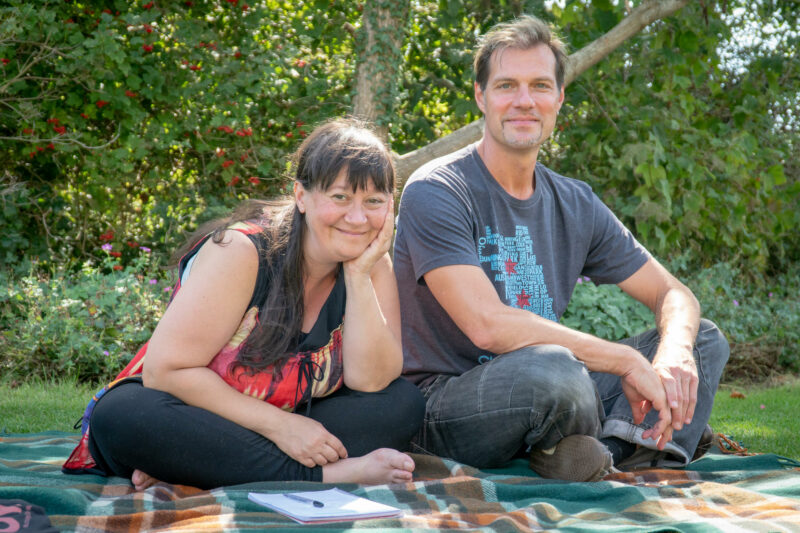 Rossella and Andreas in a park sitting on a picnic blanket