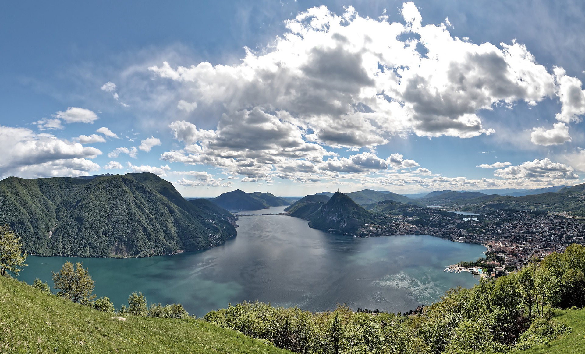 Vista of lake Lugano, Lugano city and surrounding mountains